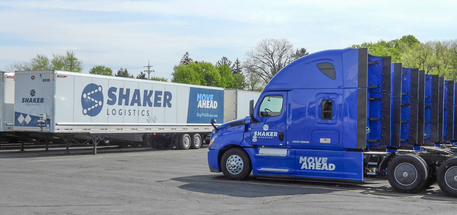 tractors and trailers in parking lot